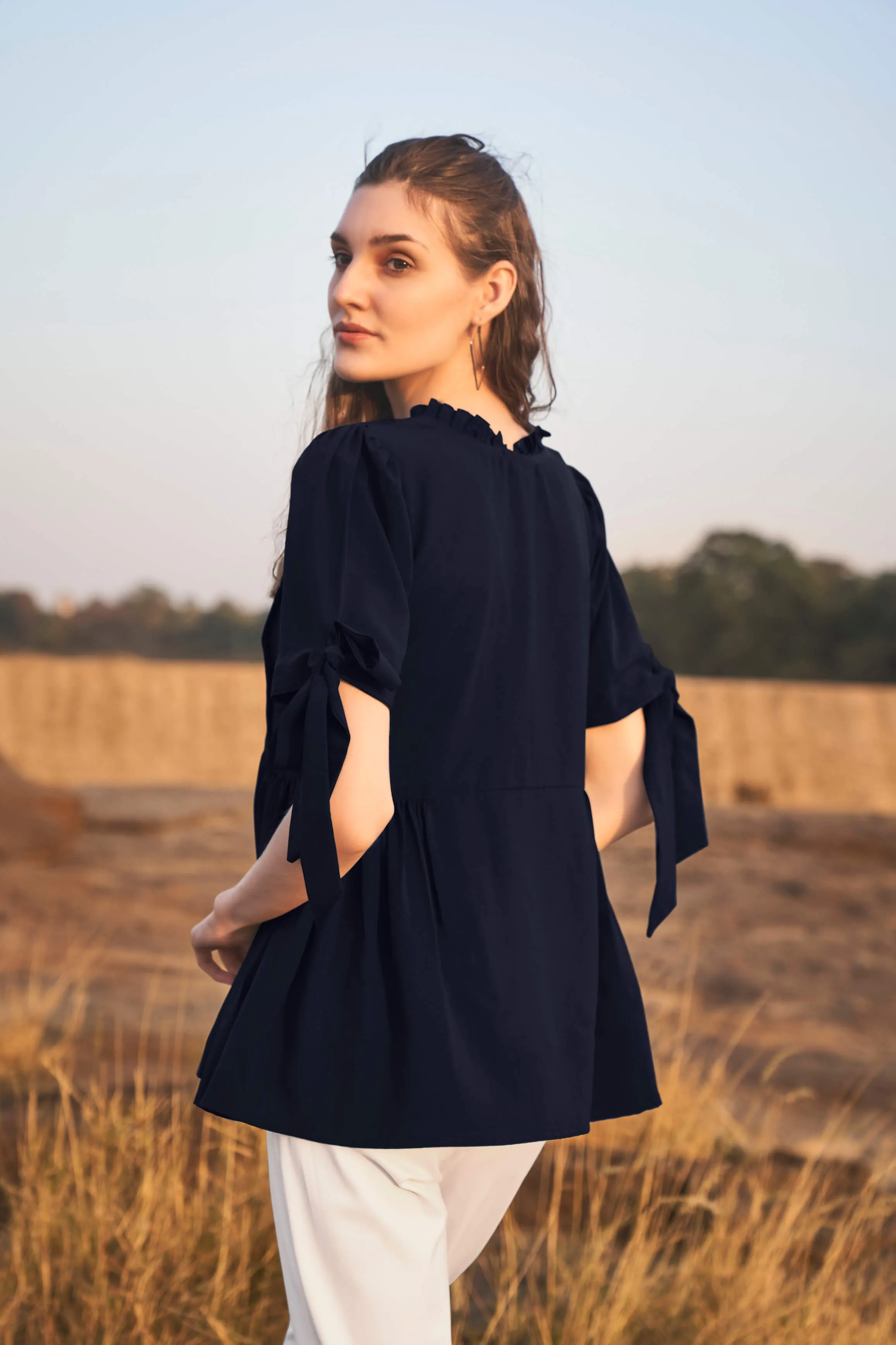 Navy Knotted Sleeve Ruffle Neck Peplum Top